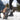 two people walking in the snow